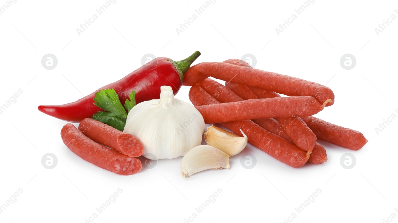 Photo of Thin dry smoked sausages and different spices isolated on white