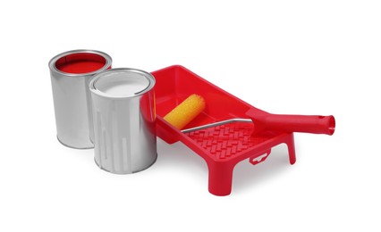 Photo of Cans of paints, tray and roller isolated on white