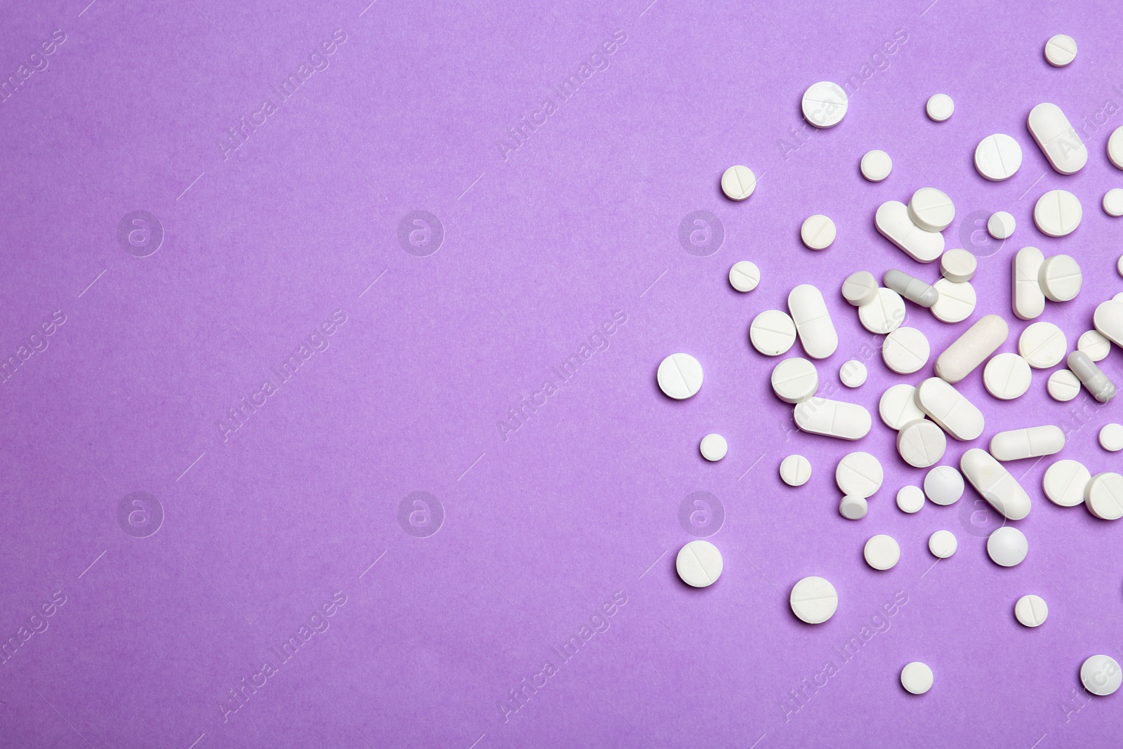 Photo of Flat lay composition with pills and space for text on color background. Medical treatment