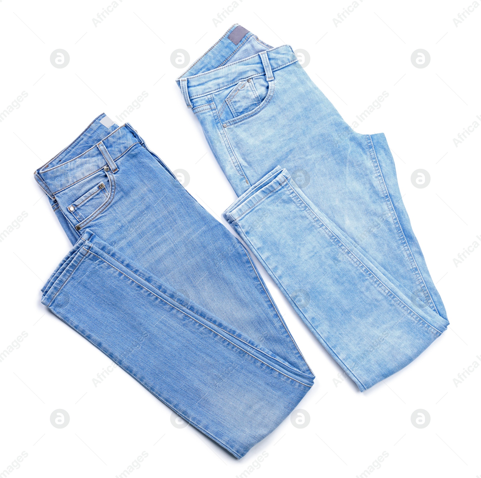 Photo of Stylish jeans on white background, top view