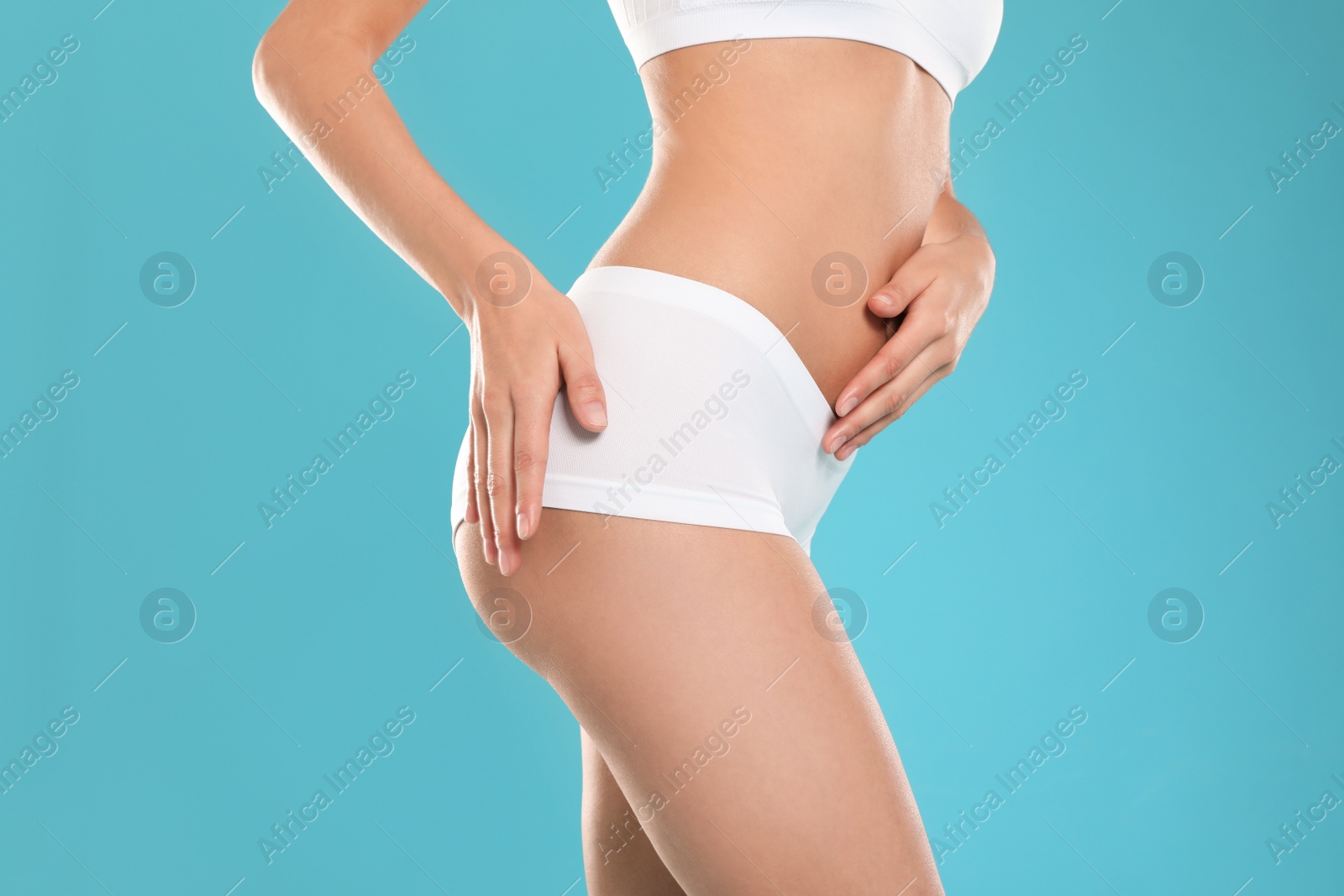 Photo of Slim young woman with smooth gentle skin on color background, closeup. Beauty and body care concept