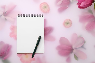 Photo of Guest list. Notebook, pen and magnolia on spring floral background, flat lay. Space for text