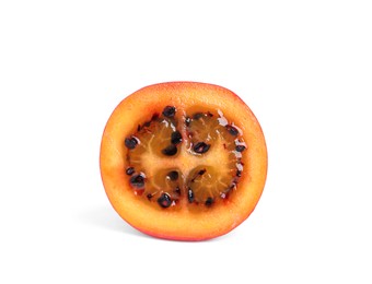 Photo of Half of ripe tamarillo isolated on white. Exotic fruit