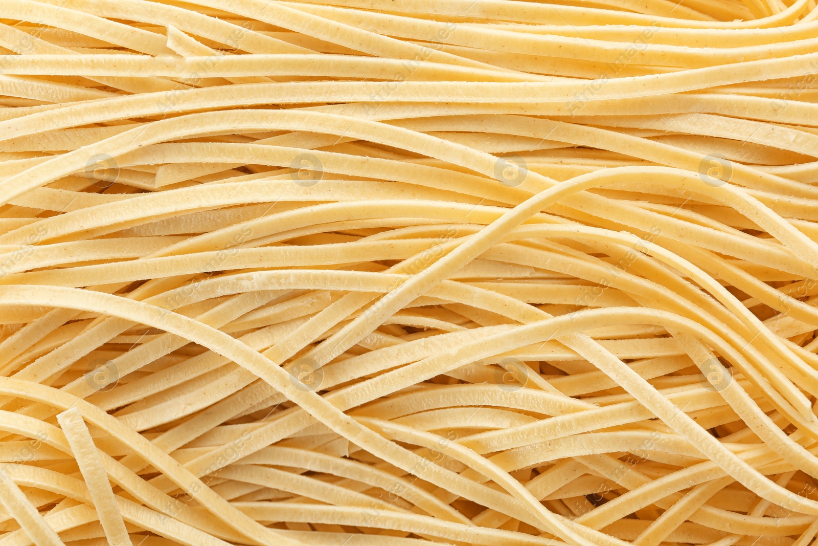 Photo of Quick cooking noodles as background, closeup view