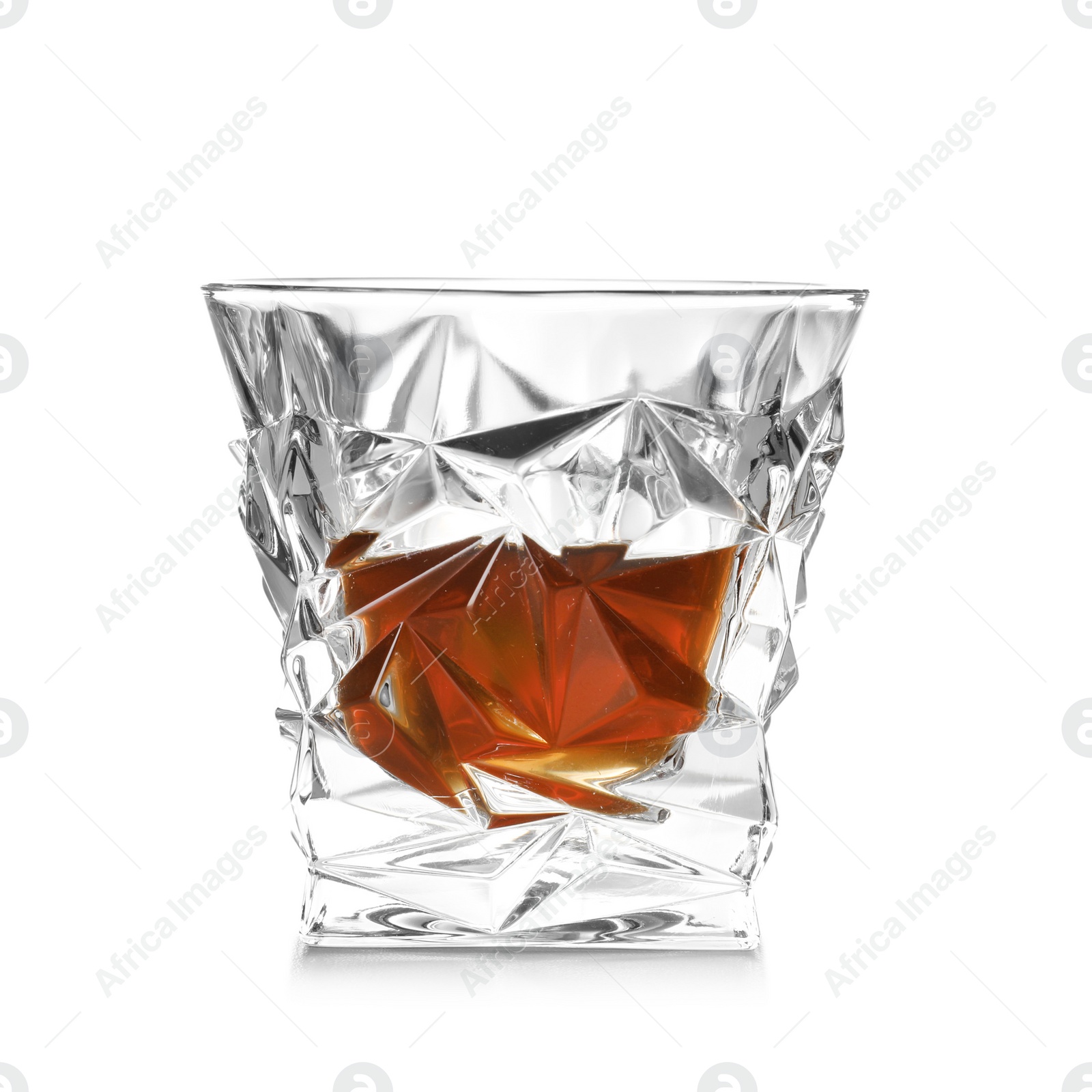 Photo of Glass of expensive whiskey on white background