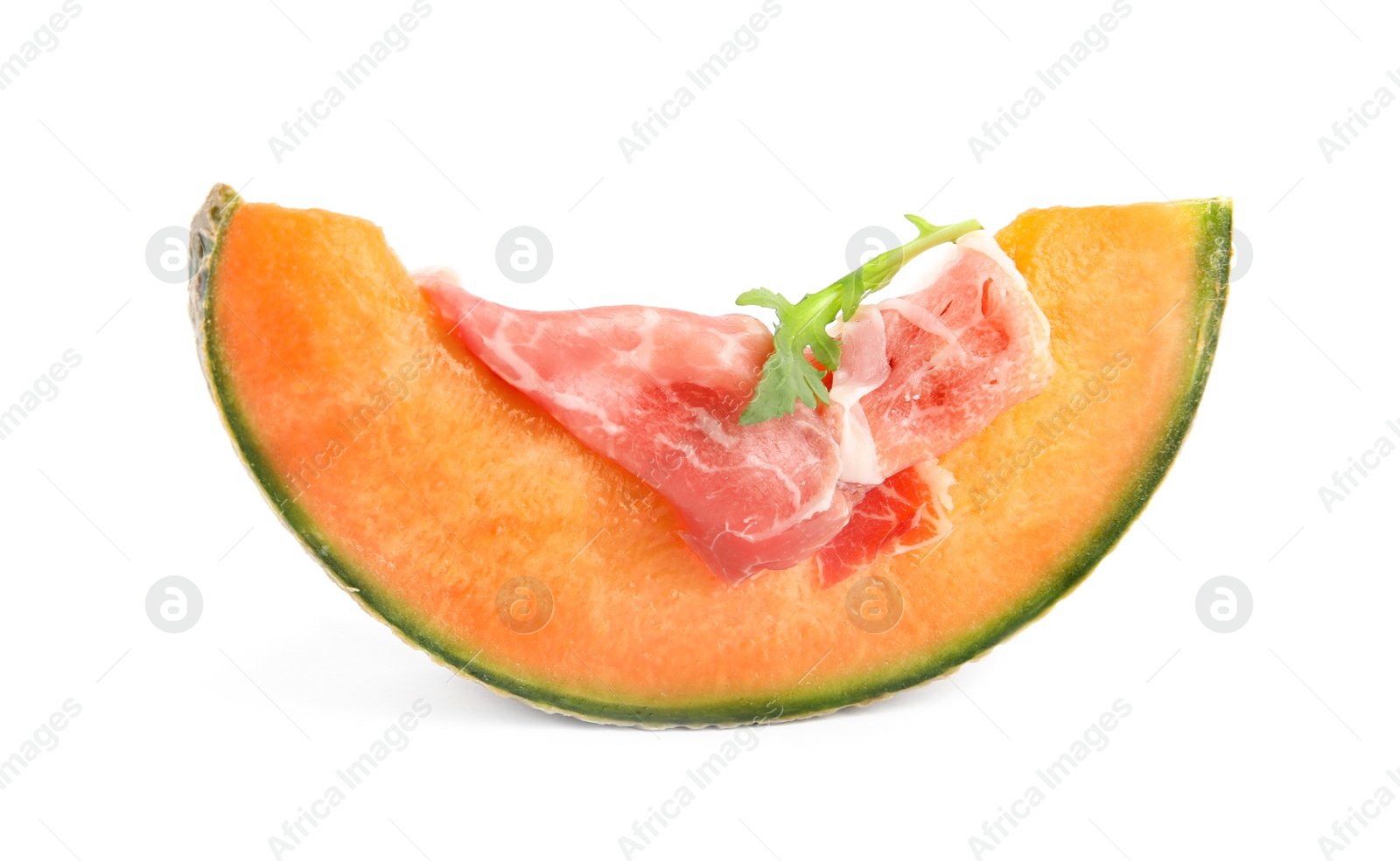 Photo of Slice of fresh melon with prosciutto and arugula on white background