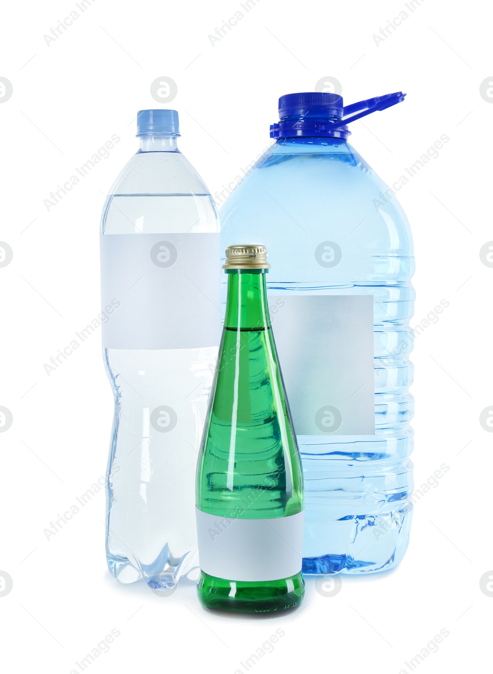 Photo of Different bottles of pure water with blank tags on white background