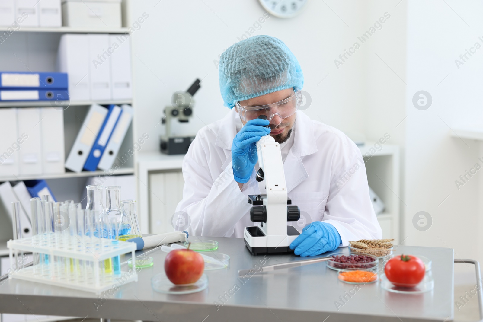 Photo of Quality control. Food inspector checking safety of products in laboratory