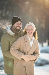 Beautiful young couple enjoying winter day outdoors