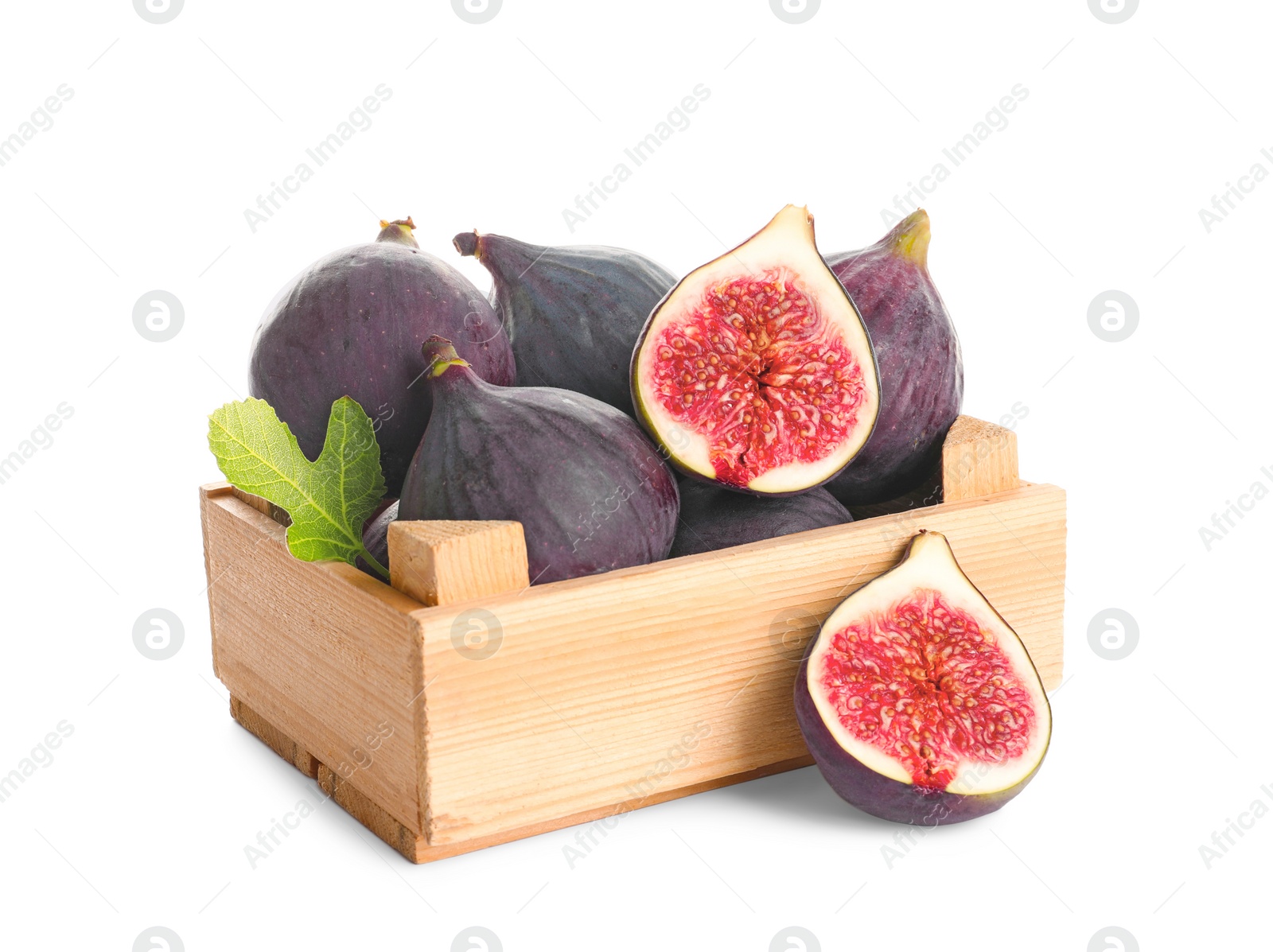 Photo of Crate with whole and cut purple figs on white background