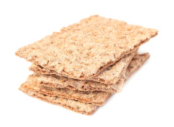 Photo of Stack of fresh crunchy crispbreads on white background. Healthy snack