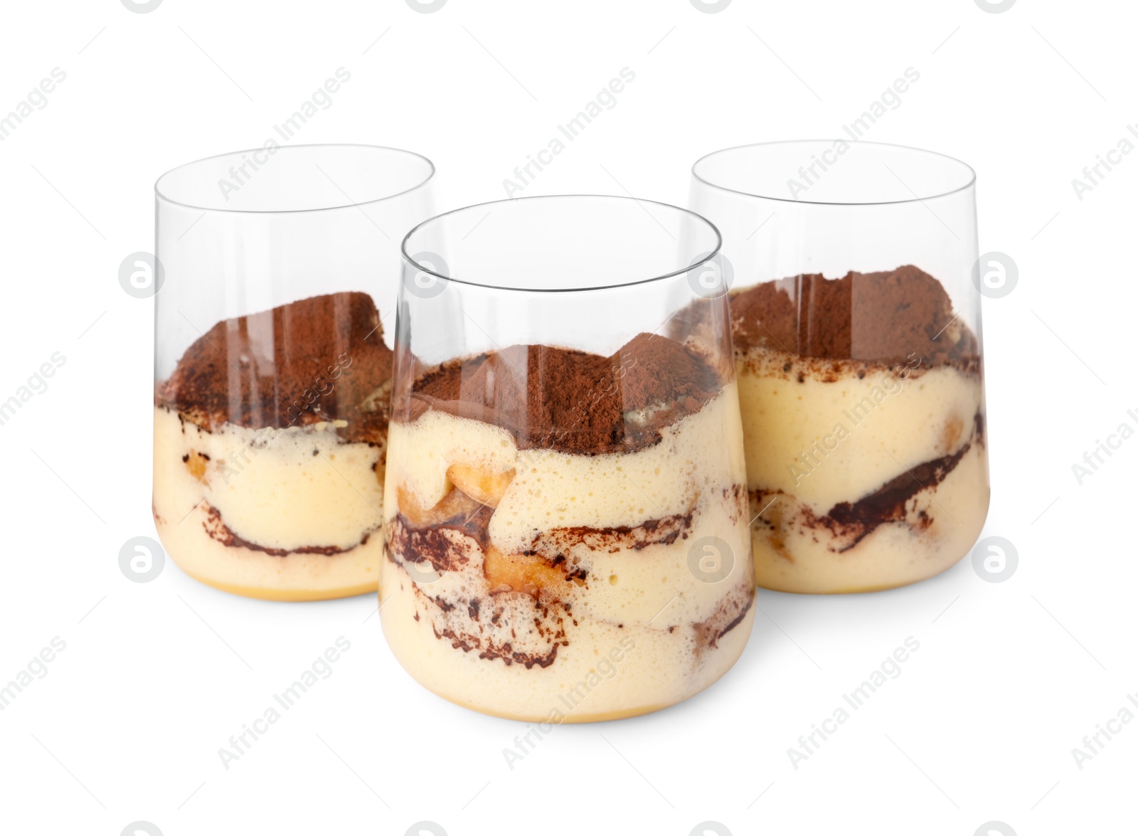 Photo of Delicious tiramisu in glasses isolated on white