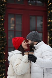 Lovely couple spending time together on city street