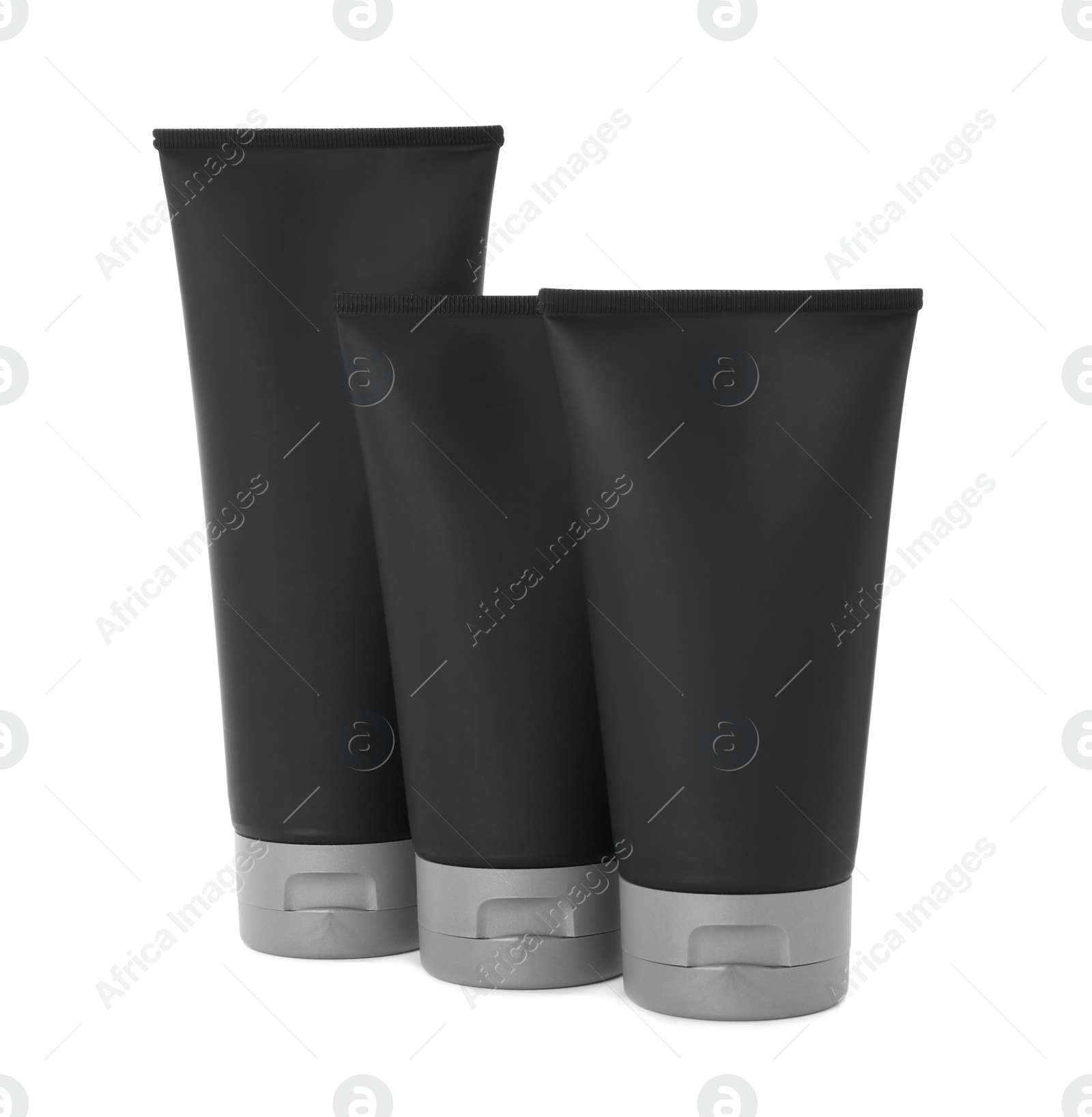 Photo of Black tubes with men's cosmetic products on white background