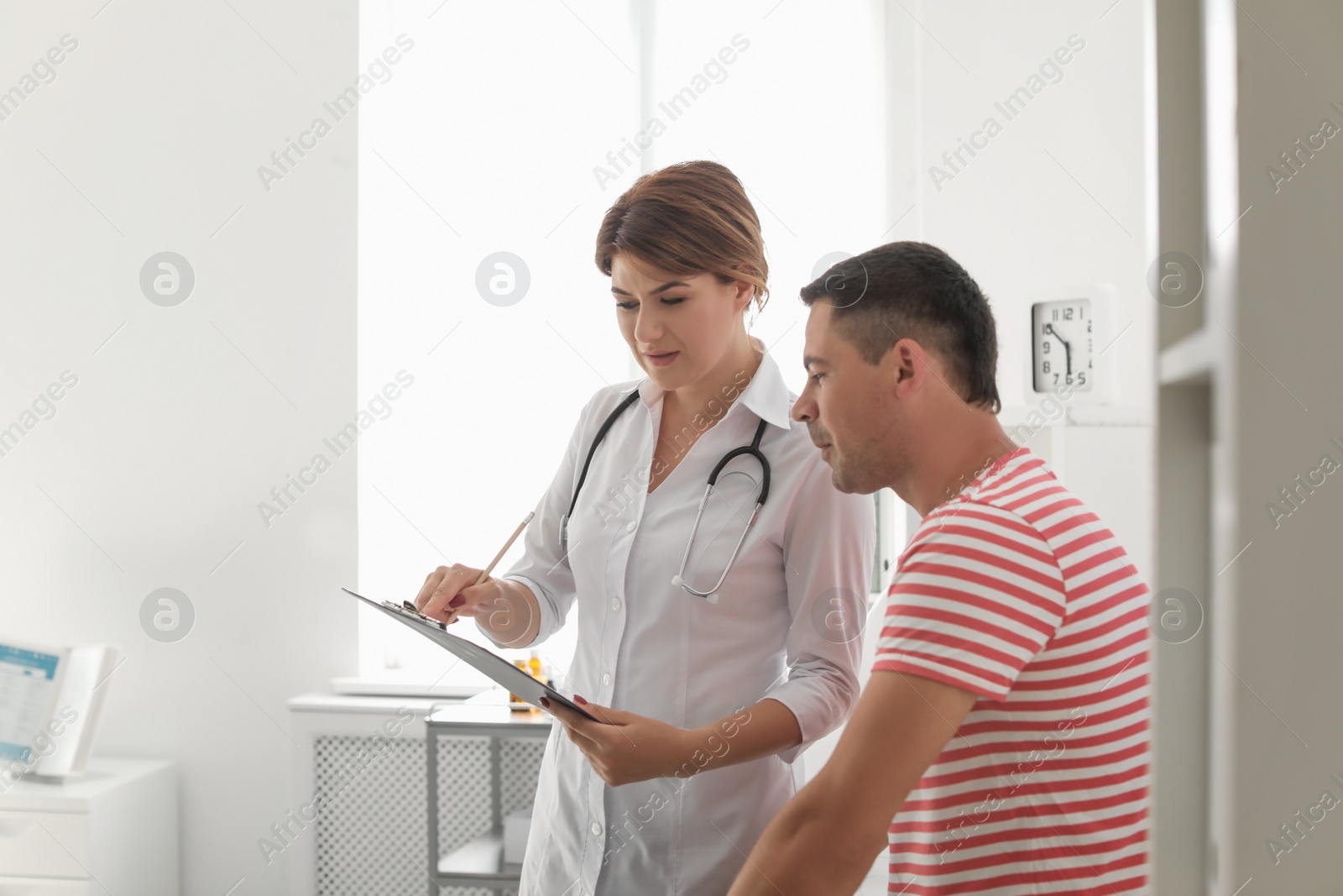 Photo of Patient having appointment with doctor in hospital