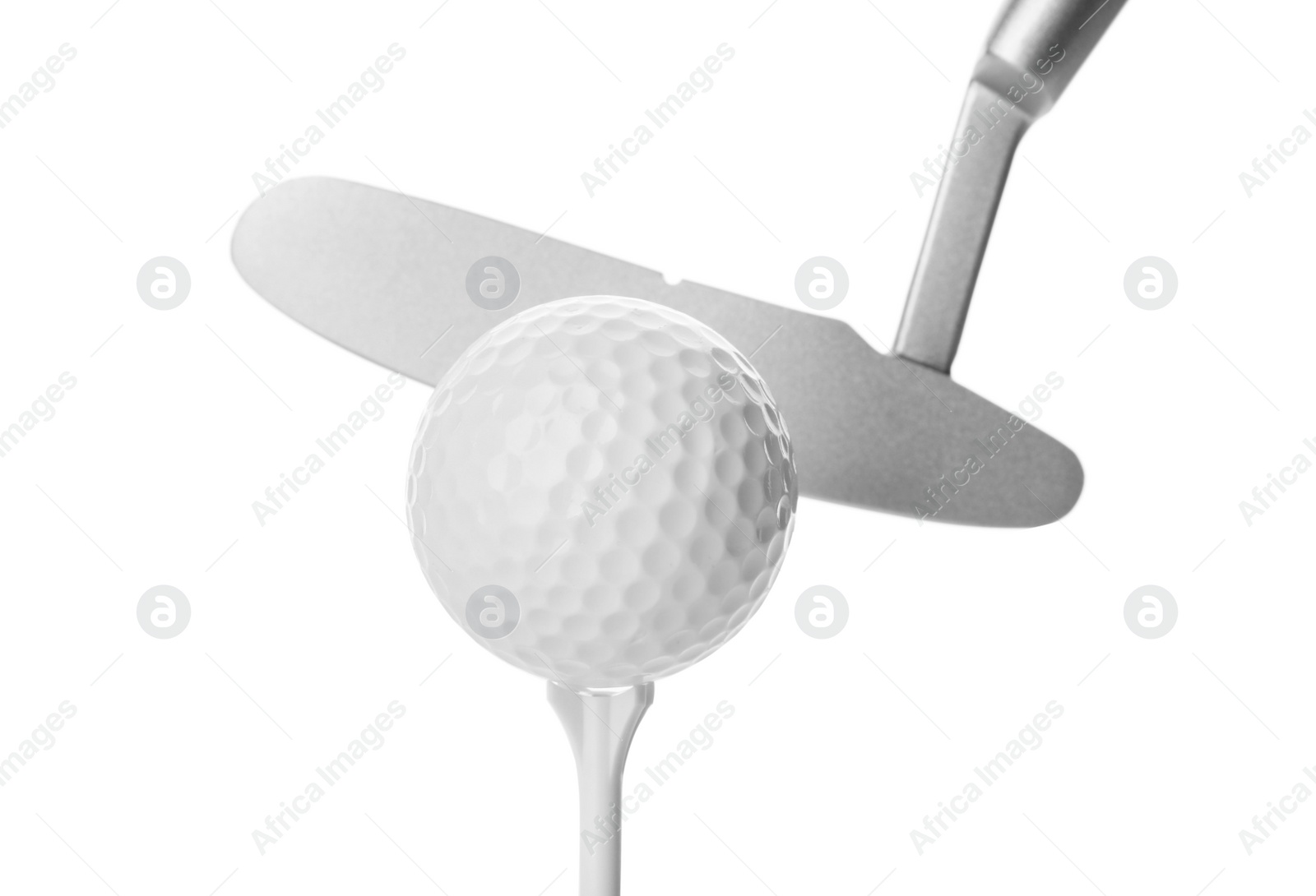 Photo of Hitting golf ball on tee with club against white background