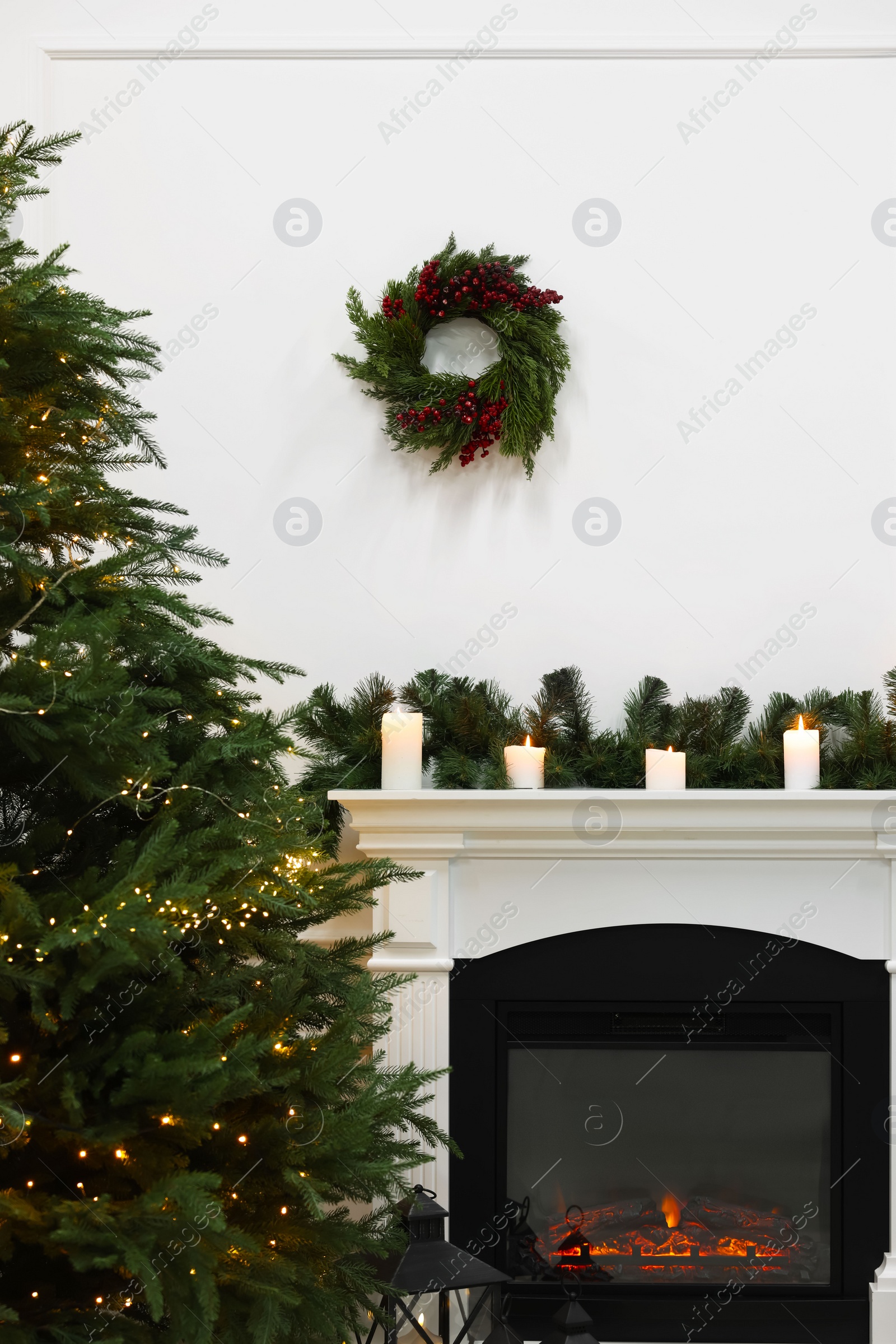 Photo of Beautiful living room interior with decorated Christmas tree