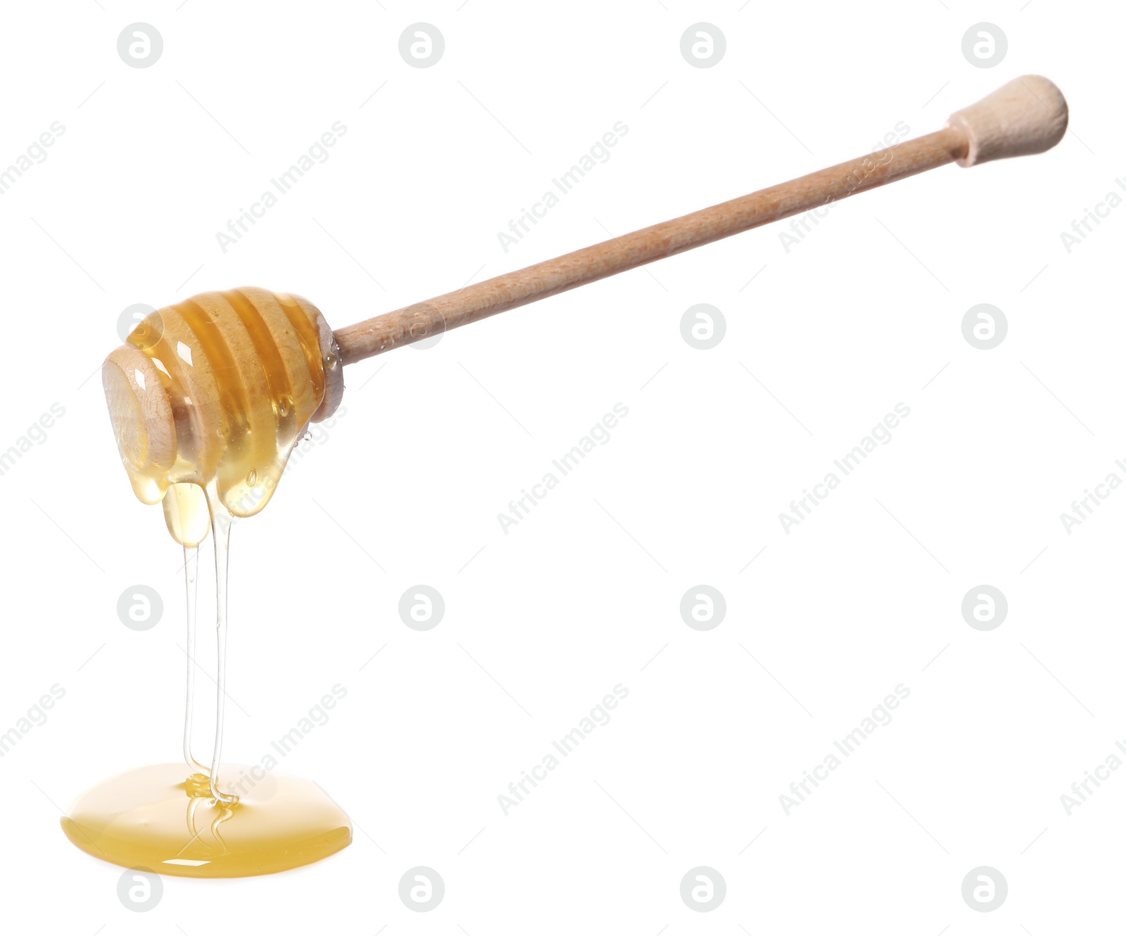 Photo of Natural honey dripping from dipper on white background