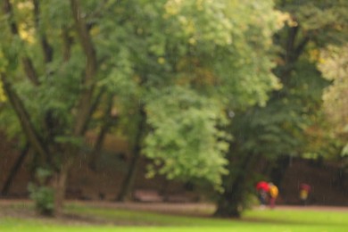 Photo of Blurred view of park on rainy day