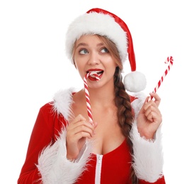 Photo of Beautiful Santa girl with candy canes on white background. Christmas eve