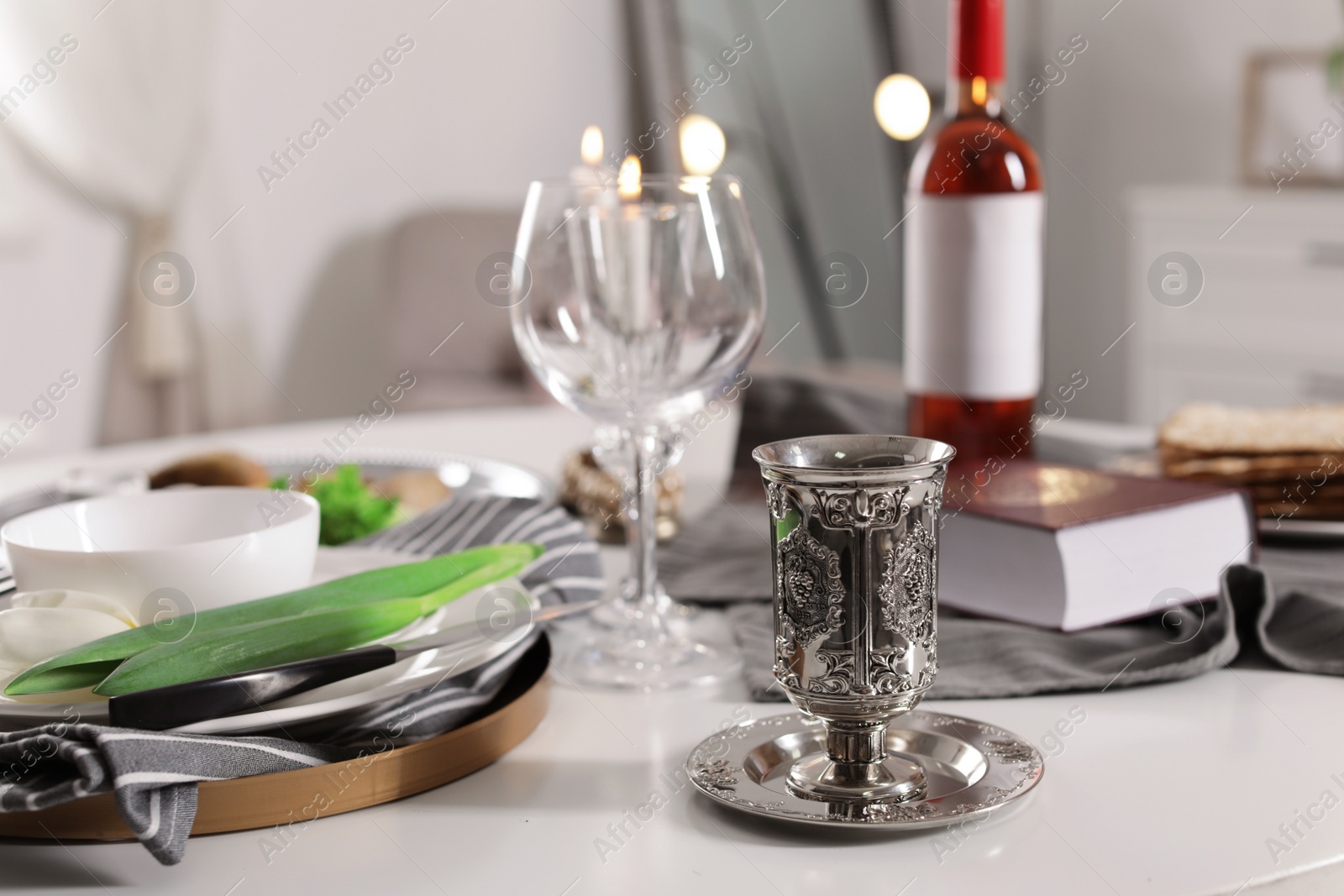 Photo of Festive Passover table setting at home. Pesach celebration