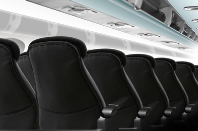 Image of Modern cabin with comfortable seats in airplane