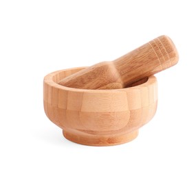 Wooden mortar and pestle on white background