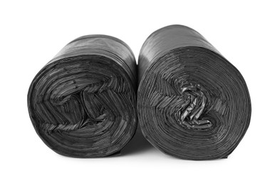 Rolls of black garbage bags isolated on white