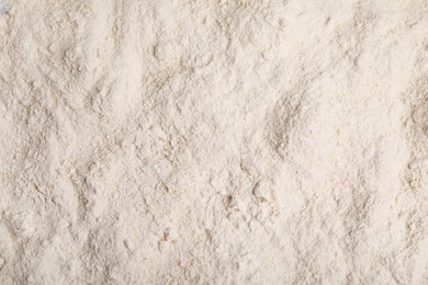 Photo of Pile of quinoa flour as background, top view