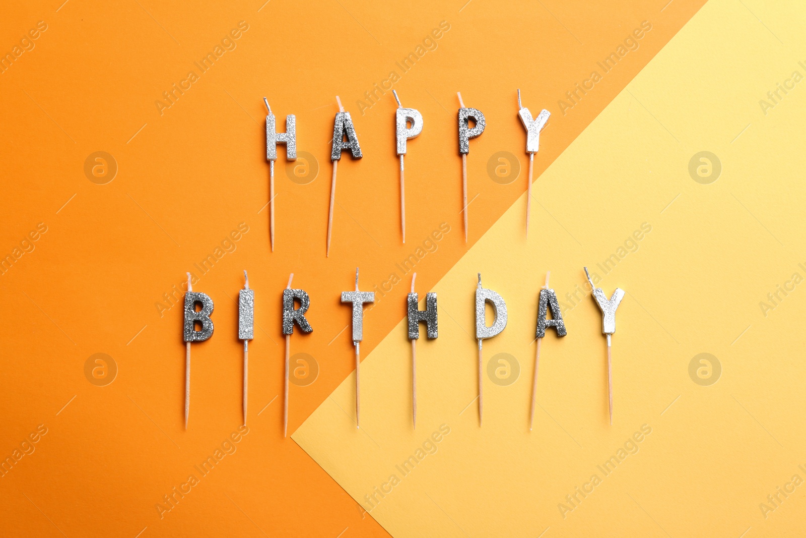 Photo of Flat lay composition with birthday candles on color background