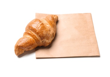 Photo of Paper bag and croissant on white background. Space for design