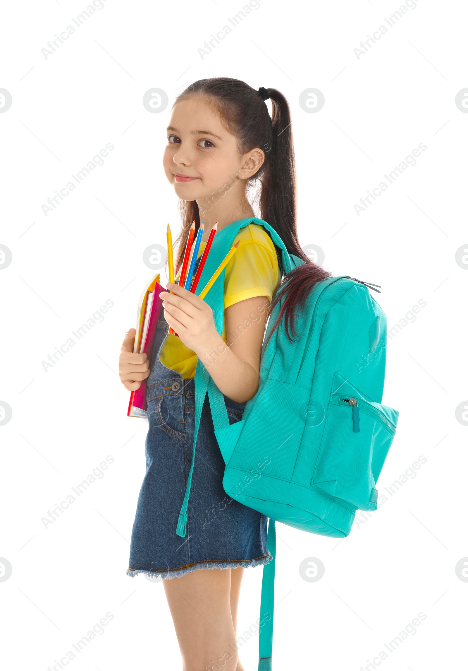 Photo of Little girl with school stationery on white background