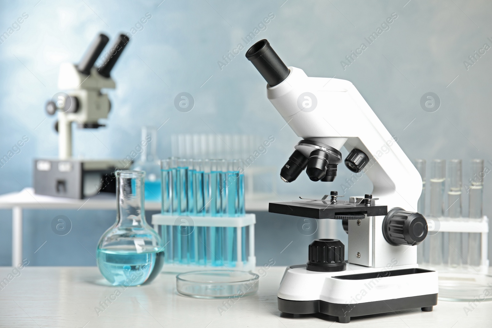 Photo of Modern microscope on table in laboratory. Medical equipment