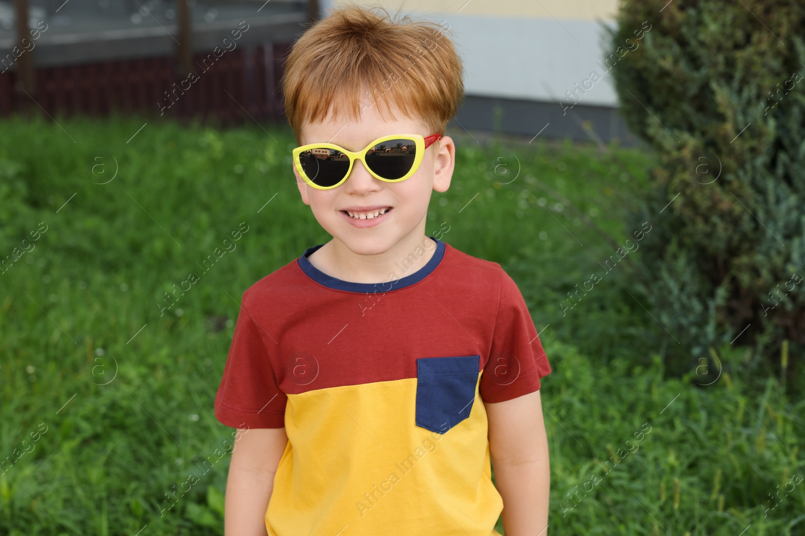 Photo of Cute little boy with sunglasses in park