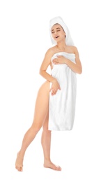 Full length portrait of young pretty woman with towels on white background