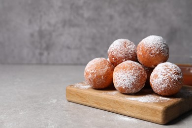Photo of Delicious sweet buns on gray table, space for text