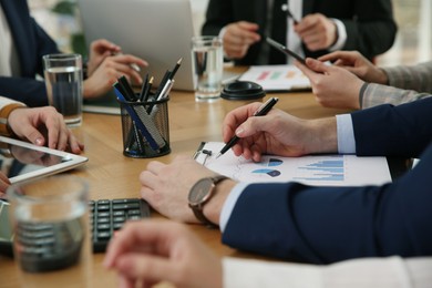 Photo of Businesspeople having meeting in office, closeup. Management consulting