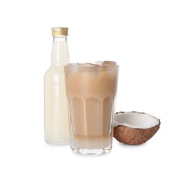 Bottle of delicious syrup, glass of iced coffee and coconut isolated on white