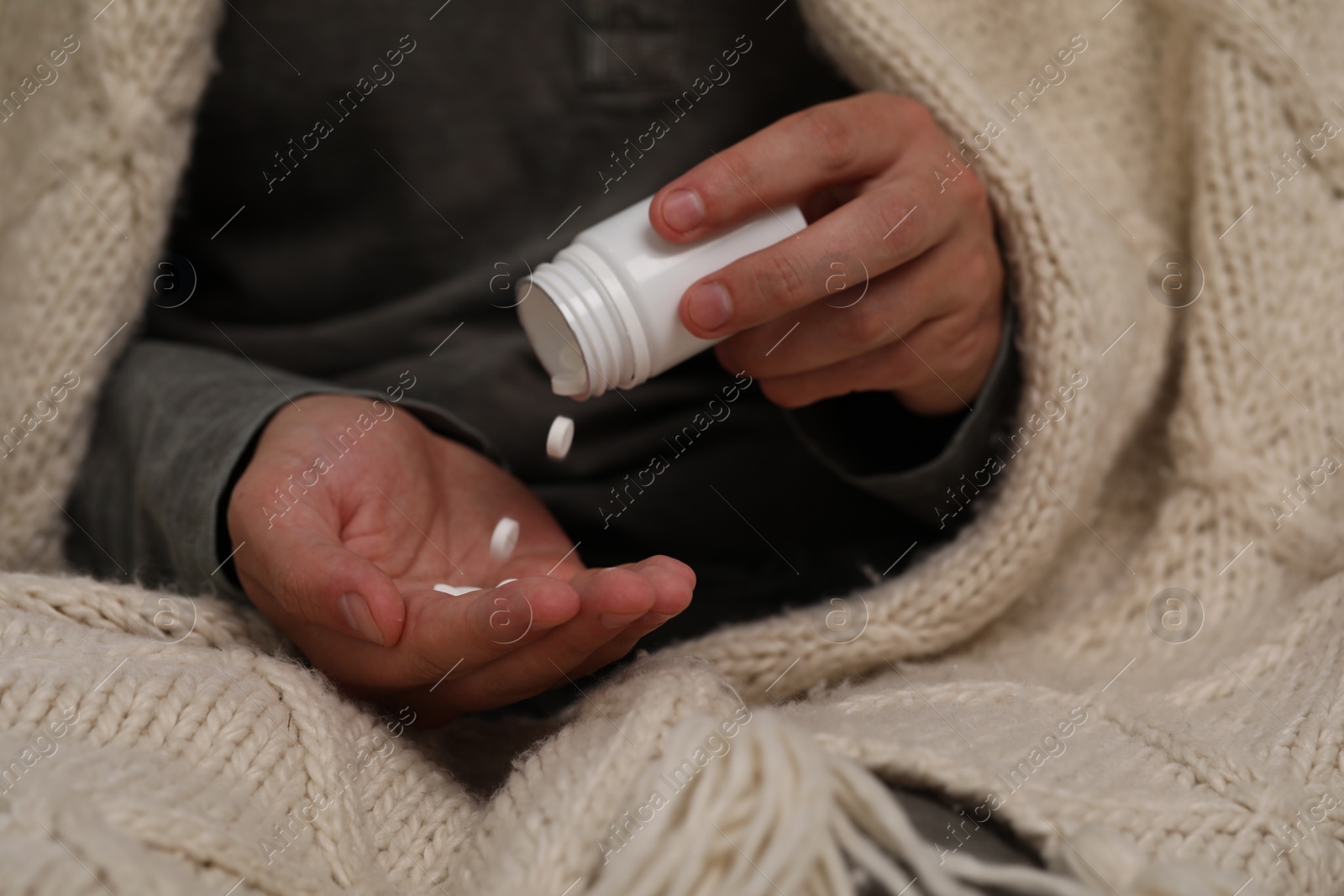 Photo of Man pouring antidepressants from bottle, closeup view