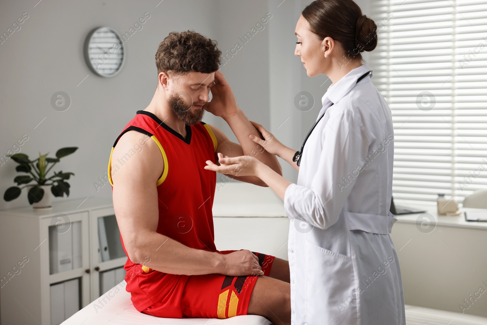 Photo of Sports injury. Doctor consulting patient in hospital