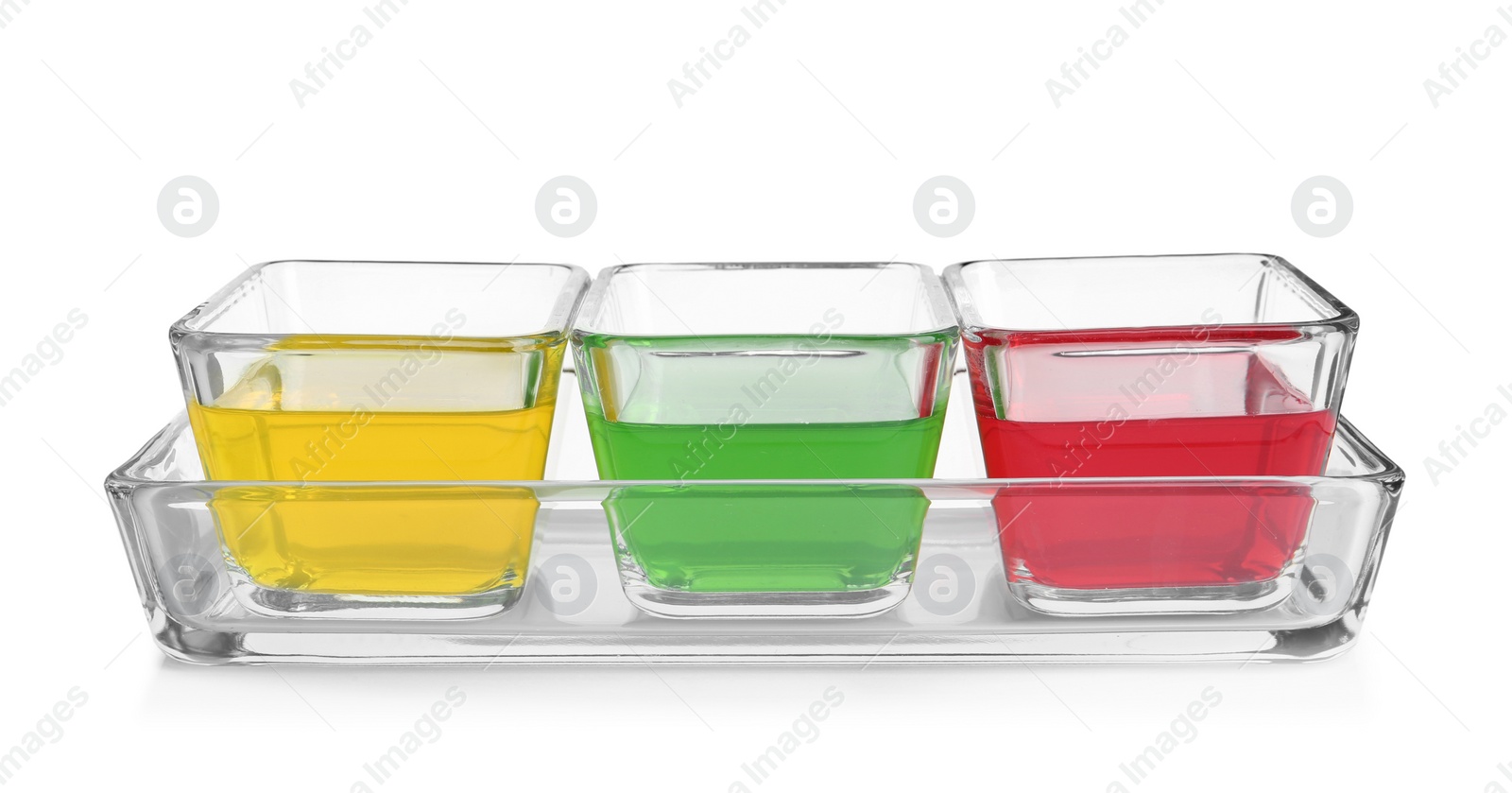 Photo of Tasty jelly desserts in glass bowls on white background