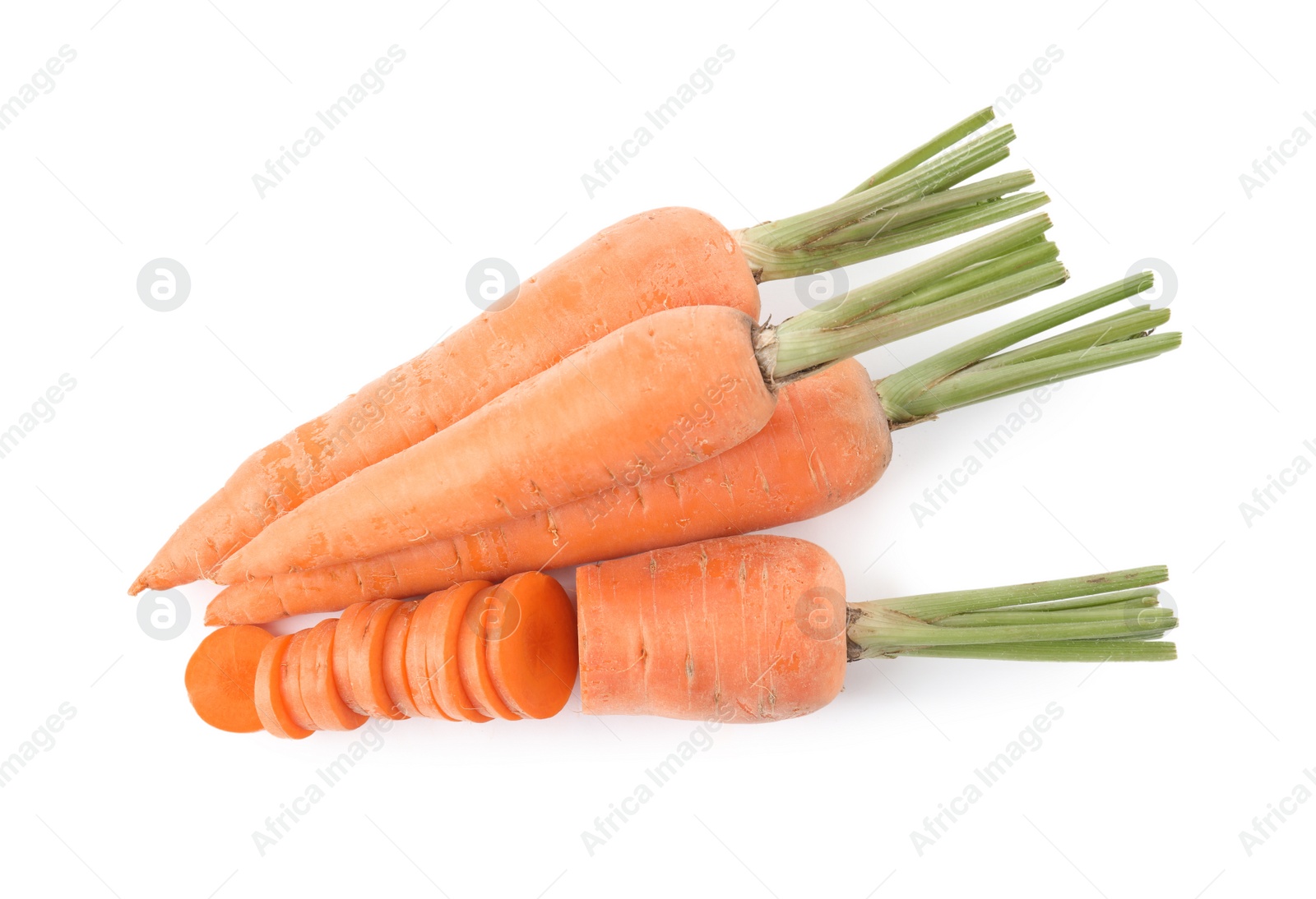 Photo of Whole and cut ripe carrots isolated on white, top view