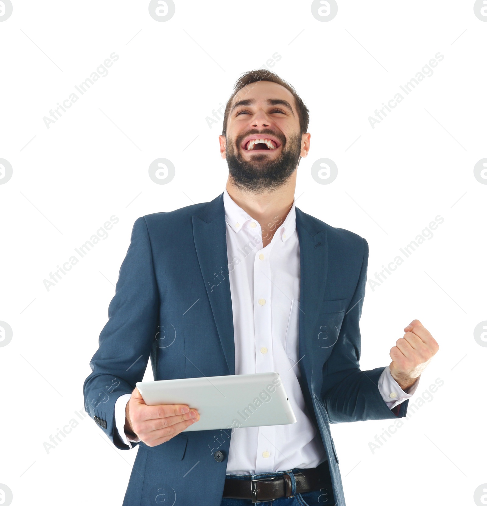 Photo of Emotional businessman in office wear with tablet celebrating victory on white background