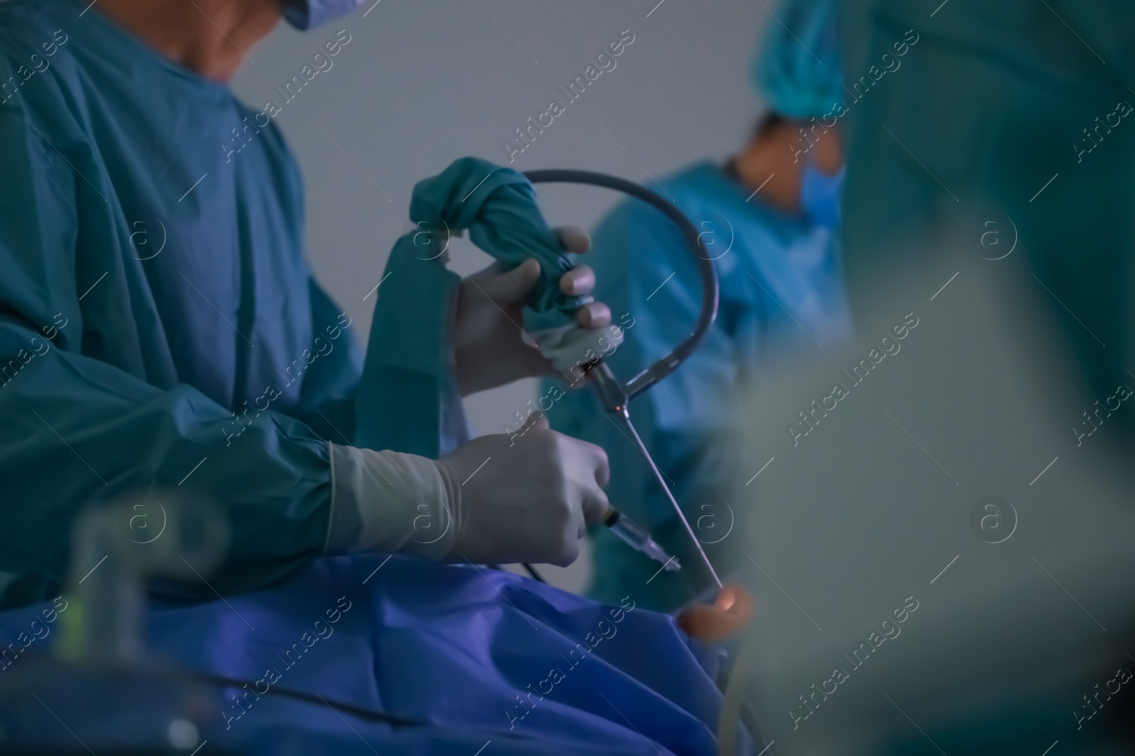 Photo of Professional doctors performing 
operation in surgery room, closeup