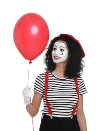 Photo of Funny mine with balloon posing on white background