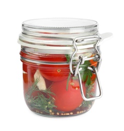 Photo of Pickled tomatoes in glass jar on white background