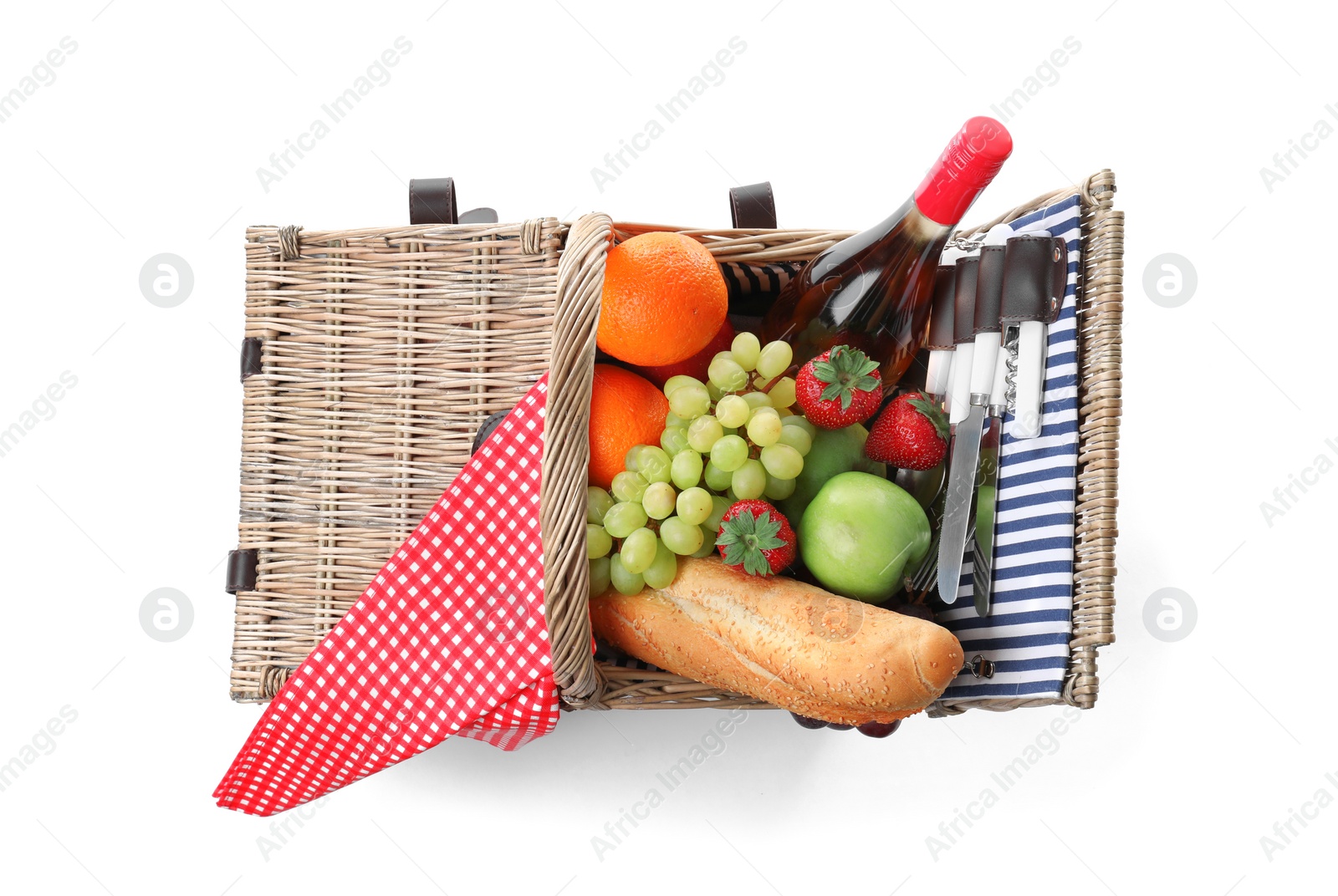 Photo of Wicker picnic basket with wine and different products on white background, top view