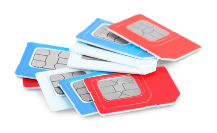 Pile of different SIM cards on white background