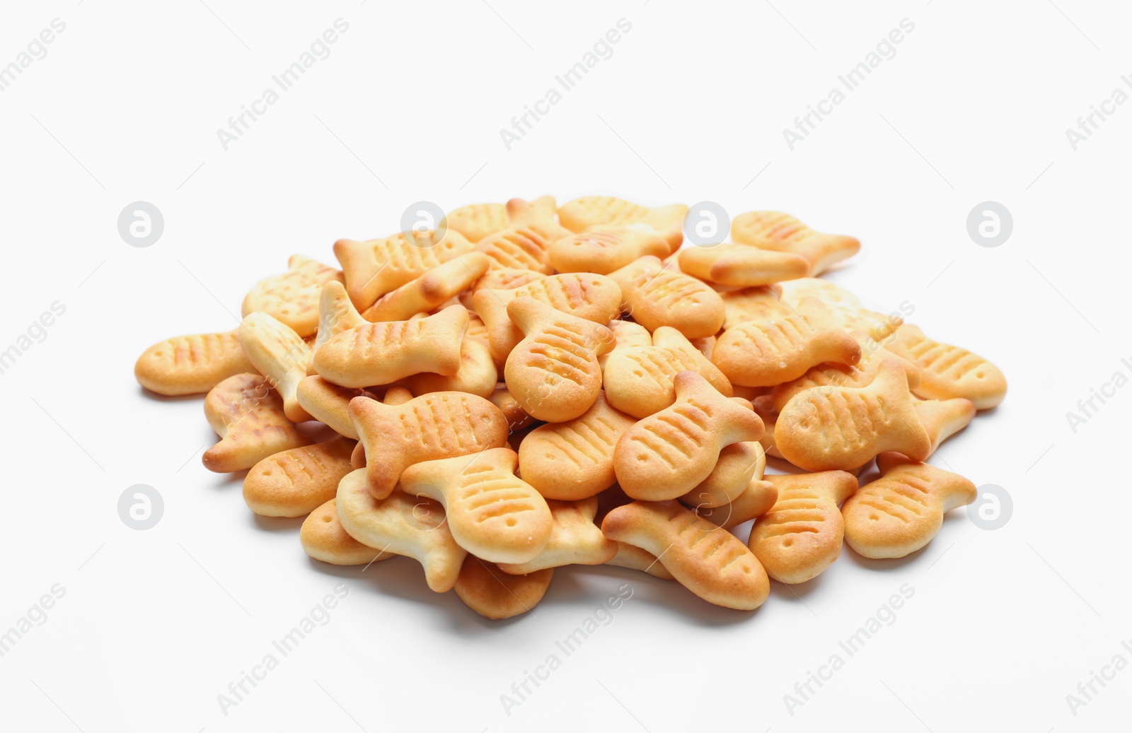 Photo of Delicious crispy goldfish crackers on white background