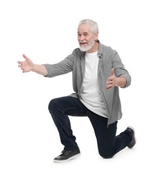 Senior man greeting someone on white background